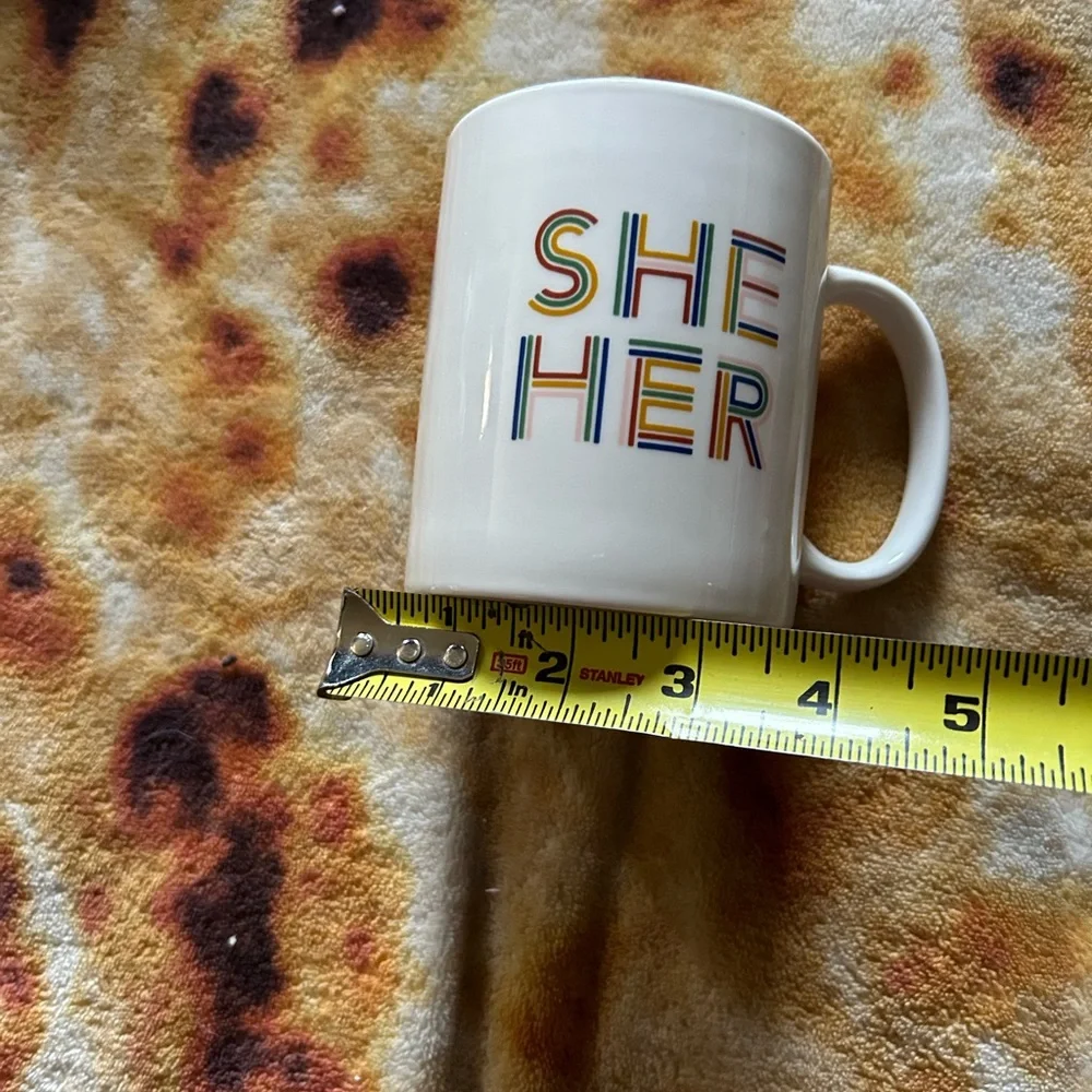 Room Essentials “She Her” coffee mug- white mug with rainbow text
